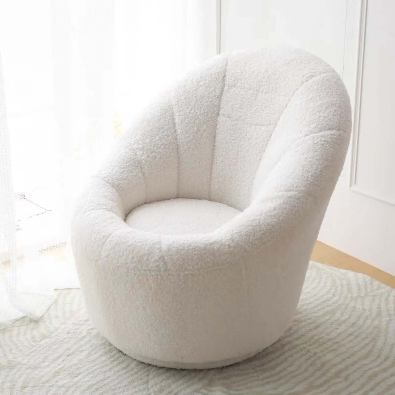 Yellow egg-shaped swivel boucle chair with sherpa upholstery, perfect as a lounge or vanity stool