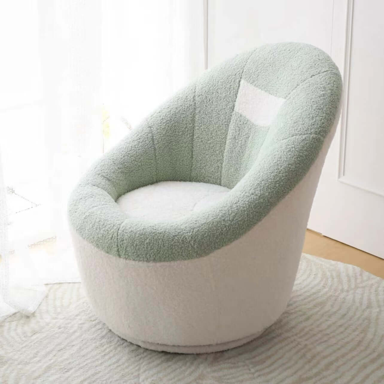 Yellow egg-shaped swivel boucle chair with sherpa upholstery, perfect as a lounge or vanity stool