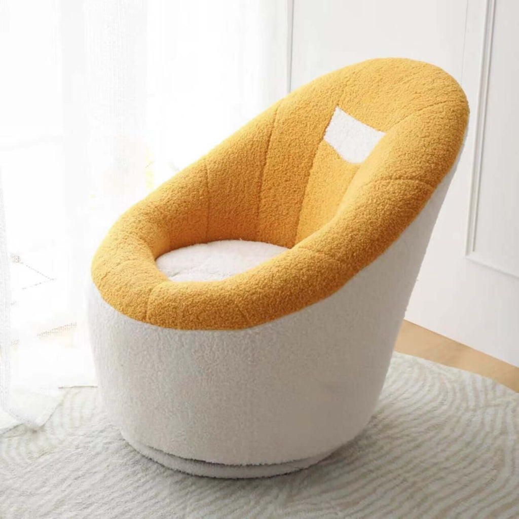 Yellow egg-shaped swivel boucle chair with sherpa upholstery, perfect as a lounge or vanity stool