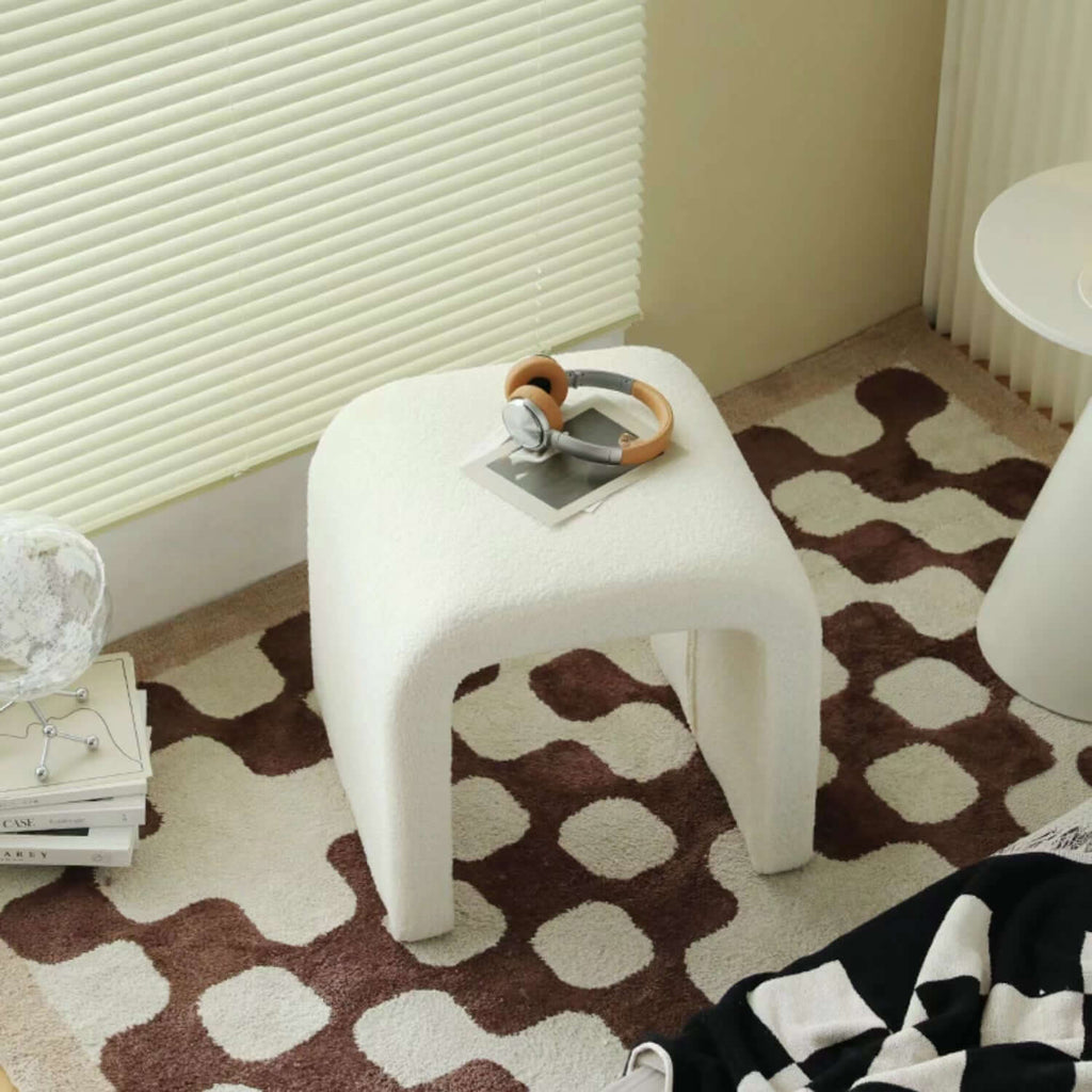 White boucle sherpa vanity stool without back featuring soft textured fabric