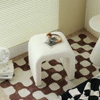 White boucle sherpa vanity stool without back featuring soft textured fabric