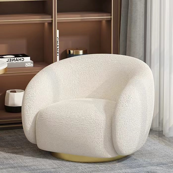 White boucle sherpa lounge chair with surrounding armrests for ultimate comfort and style