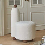 White and pink tripod accent chairs with wood legs and boucle sherpa upholstery