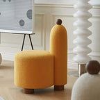 White and pink tripod accent chairs with wood legs and boucle sherpa upholstery