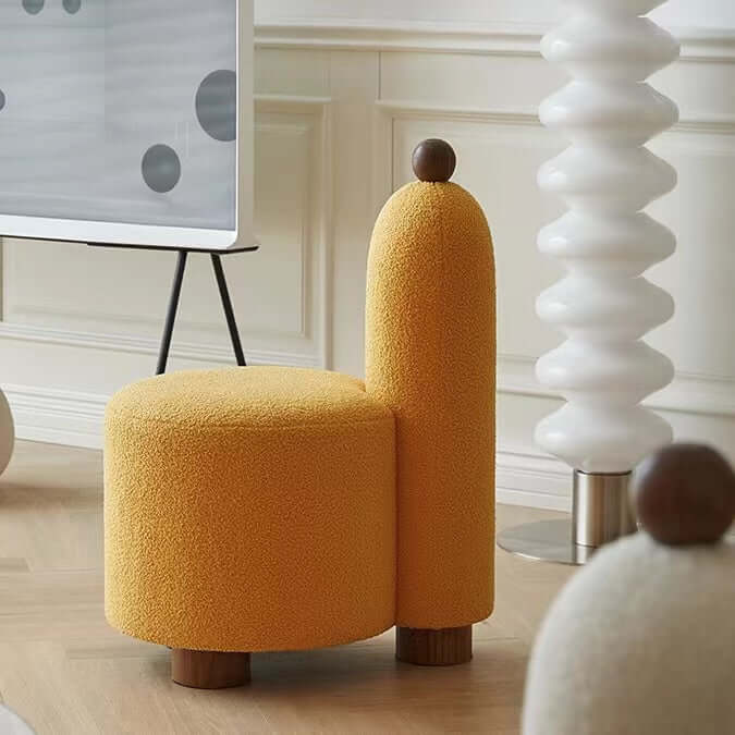 White and pink tripod accent chairs with wood legs and boucle sherpa upholstery