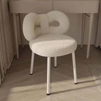 Boucle vanity stool with butterfly-shaped backrest in pink, green, and white colors