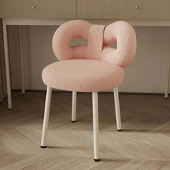 Chic pink, green, and white boucle vanity stool with butterfly-shaped backrest