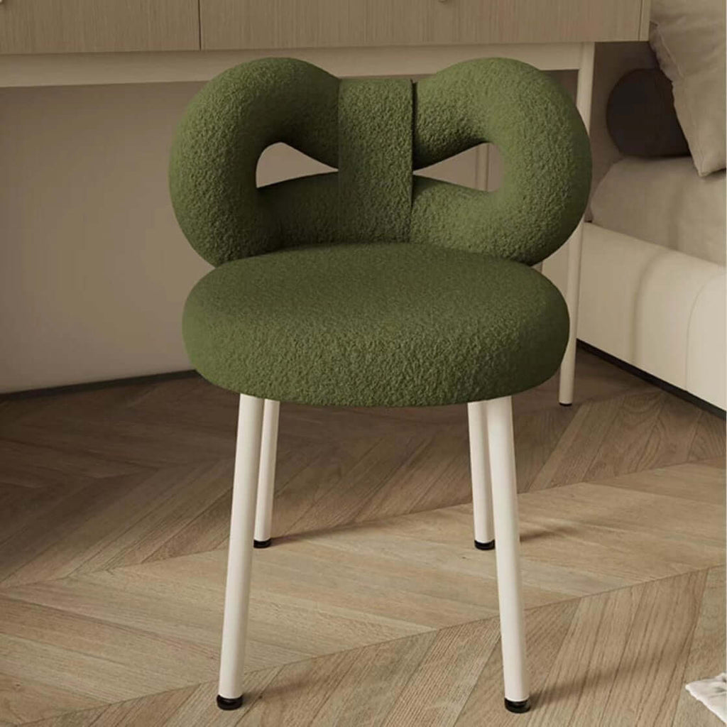 Boucle vanity stool with butterfly-shaped backrest in pink, green, and white colors