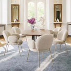 Ivory white boucle accent chair featuring stylish white metal legs for modern living spaces