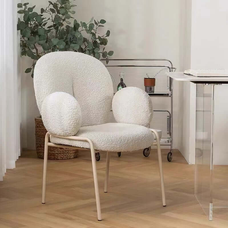 Ivory white boucle accent chair featuring stylish white metal legs for modern living spaces
