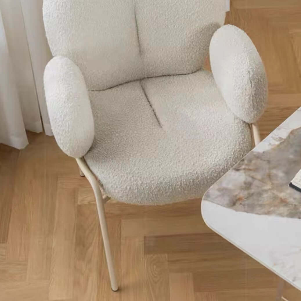 Ivory white boucle accent chair featuring stylish white metal legs for modern living spaces