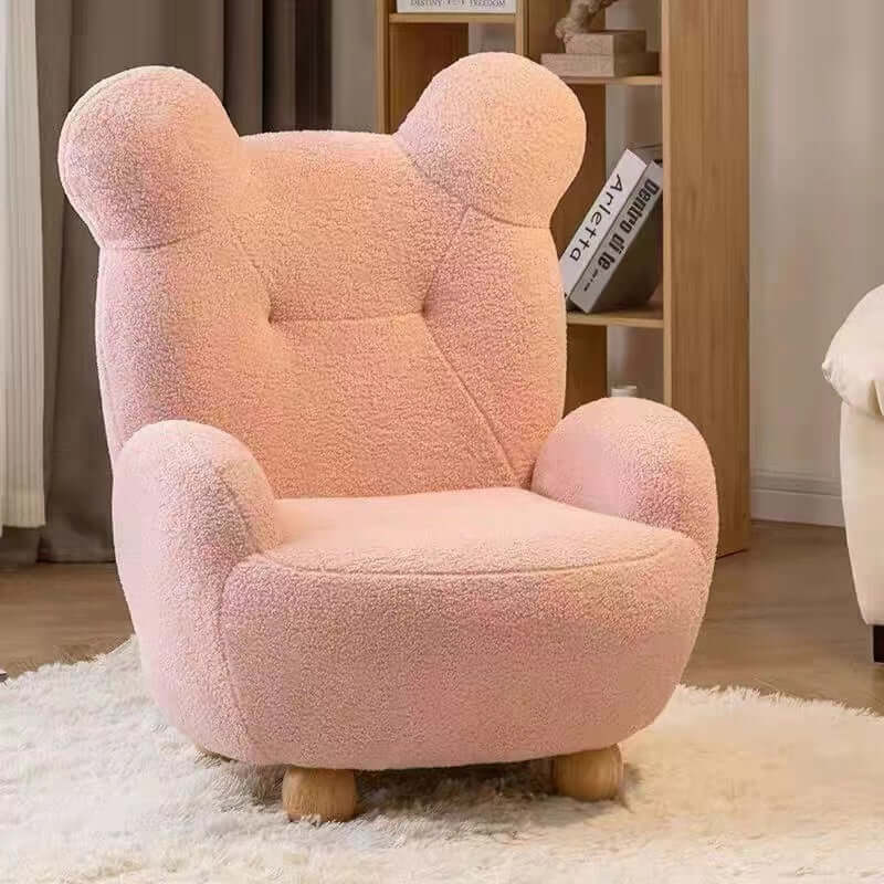 Boucle accent chair in yellow, pink, and white with a unique bear-shaped backrest