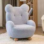 Boucle accent chair in yellow, pink, and white with a unique bear-shaped backrest