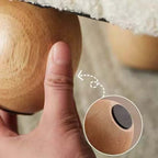 Boucle accent chair in yellow, pink, and white with a unique bear-shaped backrest