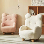 Boucle accent chair in yellow, pink, and white with a unique bear-shaped backrest