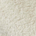 Boucle accent chair in yellow, pink, and white with a unique bear-shaped backrest