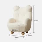 Boucle accent chair in yellow, pink, and white with a unique bear-shaped backrest