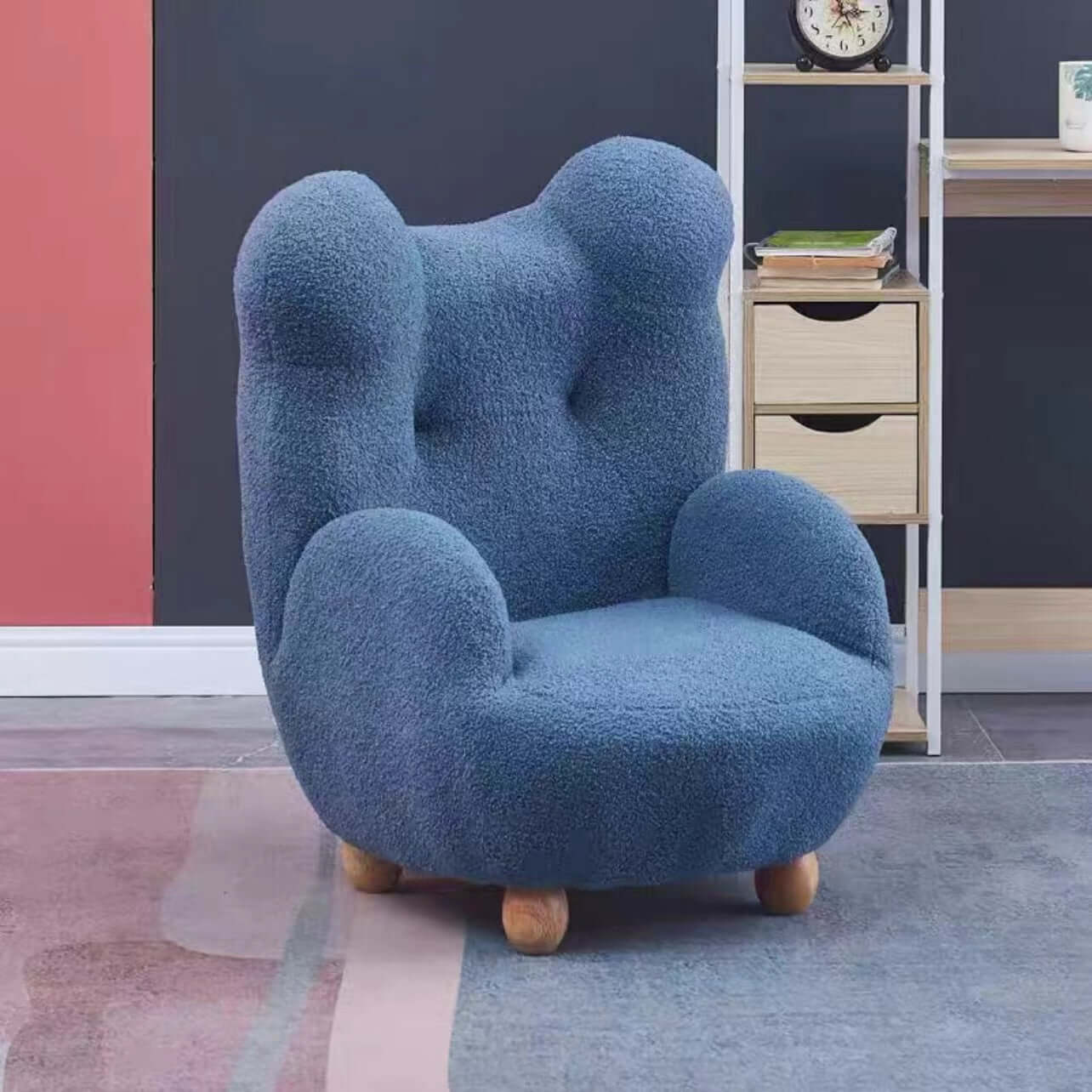 Boucle accent chair in yellow, pink, and white with a unique bear-shaped backrest