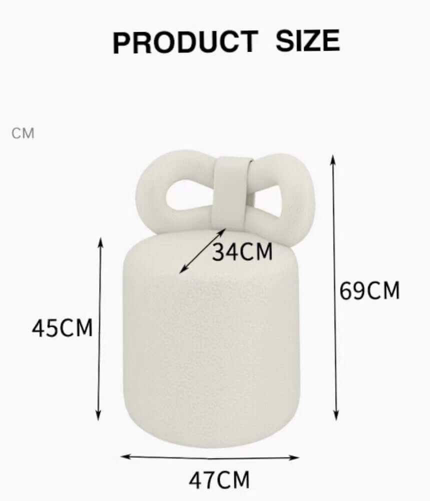 Butterfly-shaped vanity stool in cream-colored boucle fabric with soft texture