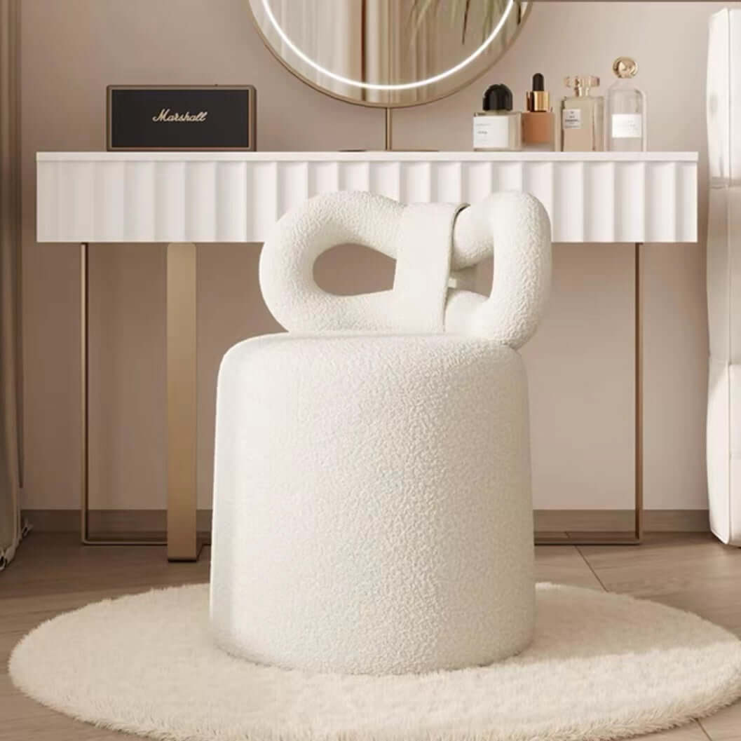 Butterfly-shaped vanity stool in cream-colored boucle fabric with soft texture main product image