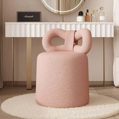 Elegant cream-colored vanity stool in butterfly shape with boucle fabric