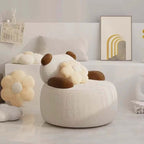 Off-white boucle sherpa bear accent chair with black and brown details, cozy lounge sofa seating