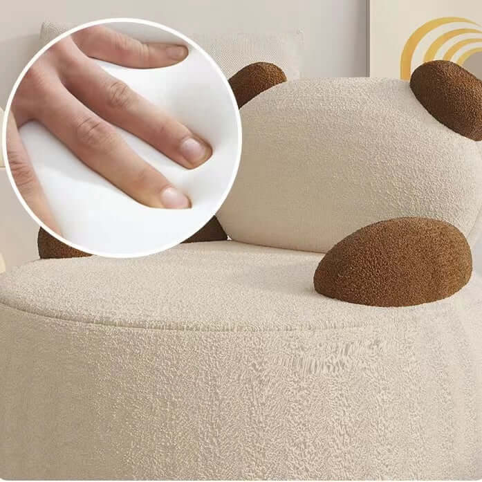 Off-white boucle sherpa bear accent chair with black and brown details, cozy lounge sofa seating