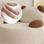 Off-white boucle sherpa bear accent chair with black and brown details, cozy lounge sofa seating