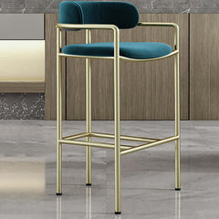 Elegant green barstool with luxurious gold legs and soft velvet upholstery for contemporary style