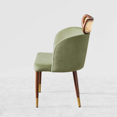 Modern green velvet dining chair with curved back design for comfortable seating