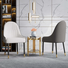 Chic set of 2 white and orange dining chairs with metal legs, upholstered in PU leather for modern dining ambiance