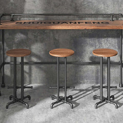 Industrial bar stool in black finish with footrest made of solid wood for bar height seating