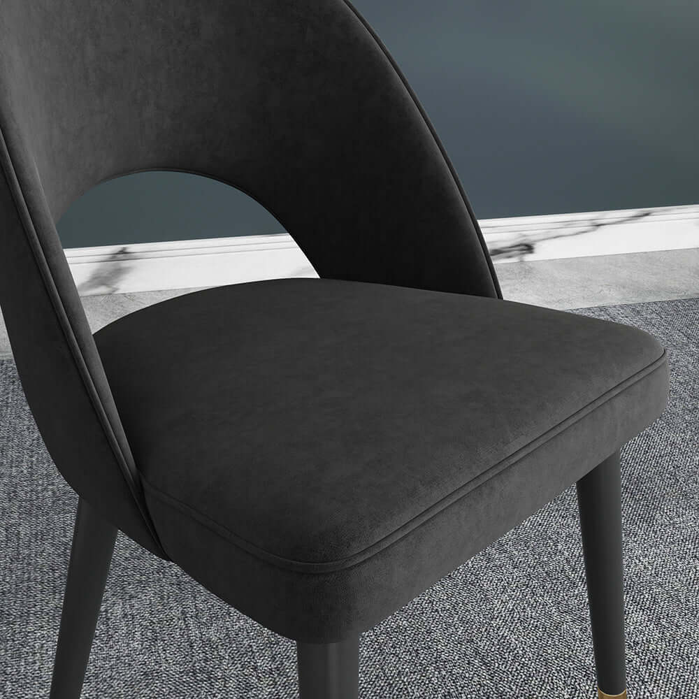 Elegant upholstered blue dining chair with a sleek curved back, perfect for a set of 2