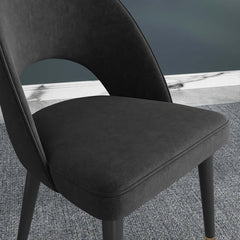 Elegant upholstered blue dining chair with a sleek curved back, perfect for a set of 2