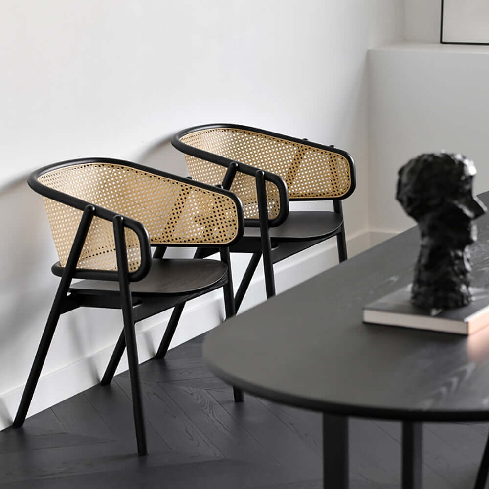 Chic black dining chair with modern rattan design
