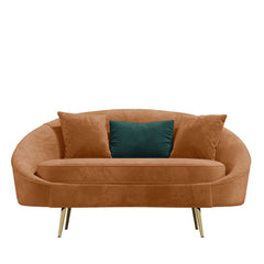 Modern 63 inch pink velvet sofa with curved design, gold metal frame, and matching toss pillow