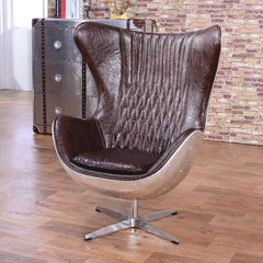 Elegant brown & silver office chair upholstered in luxurious leather with swivel and wing back features