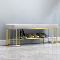 Luxurious green velvet storage bench with sturdy golden frame and convenient shelves