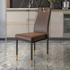 Pair of black dining chairs with stylish upholstered seats and steel legs