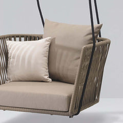 Rattan porch swing chair for outdoor relaxation with khaki cushion pillow