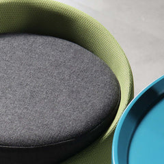 Elegant green upholstered ottoman with round shape and luxurious cotton & linen fabric