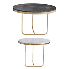 Luxurious nesting tables featuring black and white stone tops and gold bases for elegant home decor