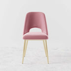 Pair of stylish black upholstered dining chairs with hollow back and metallic gold legs