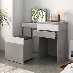 Gray makeup vanity with mirror and foldable dressing table as a stylish addition to your bedroom decor