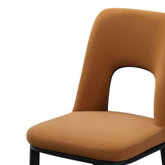 Modern orange dining chair with loop backrest armless design for comfortable seating