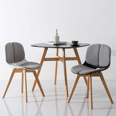 Stylish dining chair with beech legs and upholstered seat, perfect for modern dining rooms