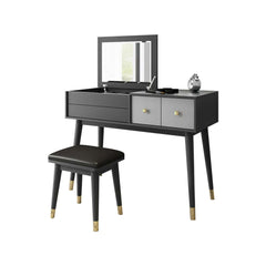 Graceful gray makeup vanity set with fliptop mirror & cushioned stool for elegance