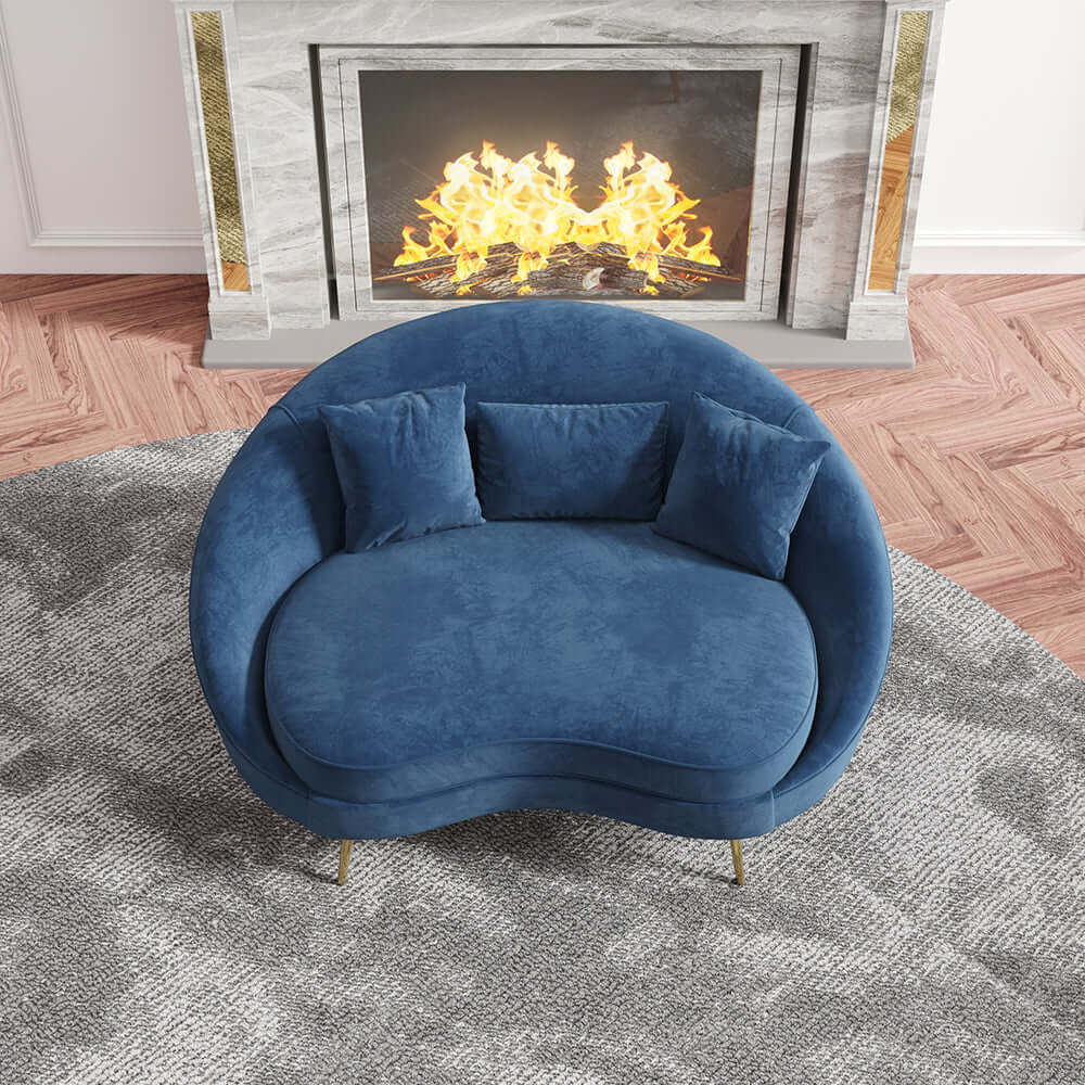 Modern pink velvet sofa with curved design, gold metal frame, and toss pillow, 63 inch length