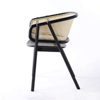 Contemporary black rattan dining chair with curved back