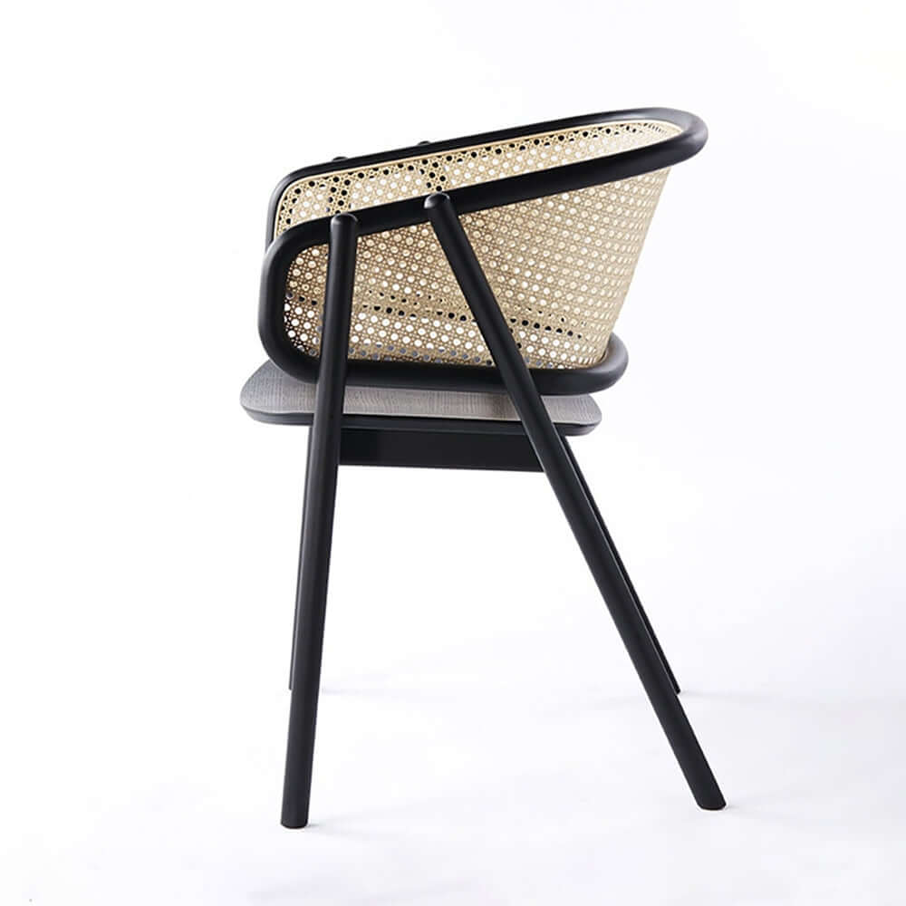 Contemporary black rattan dining chair with curved back
